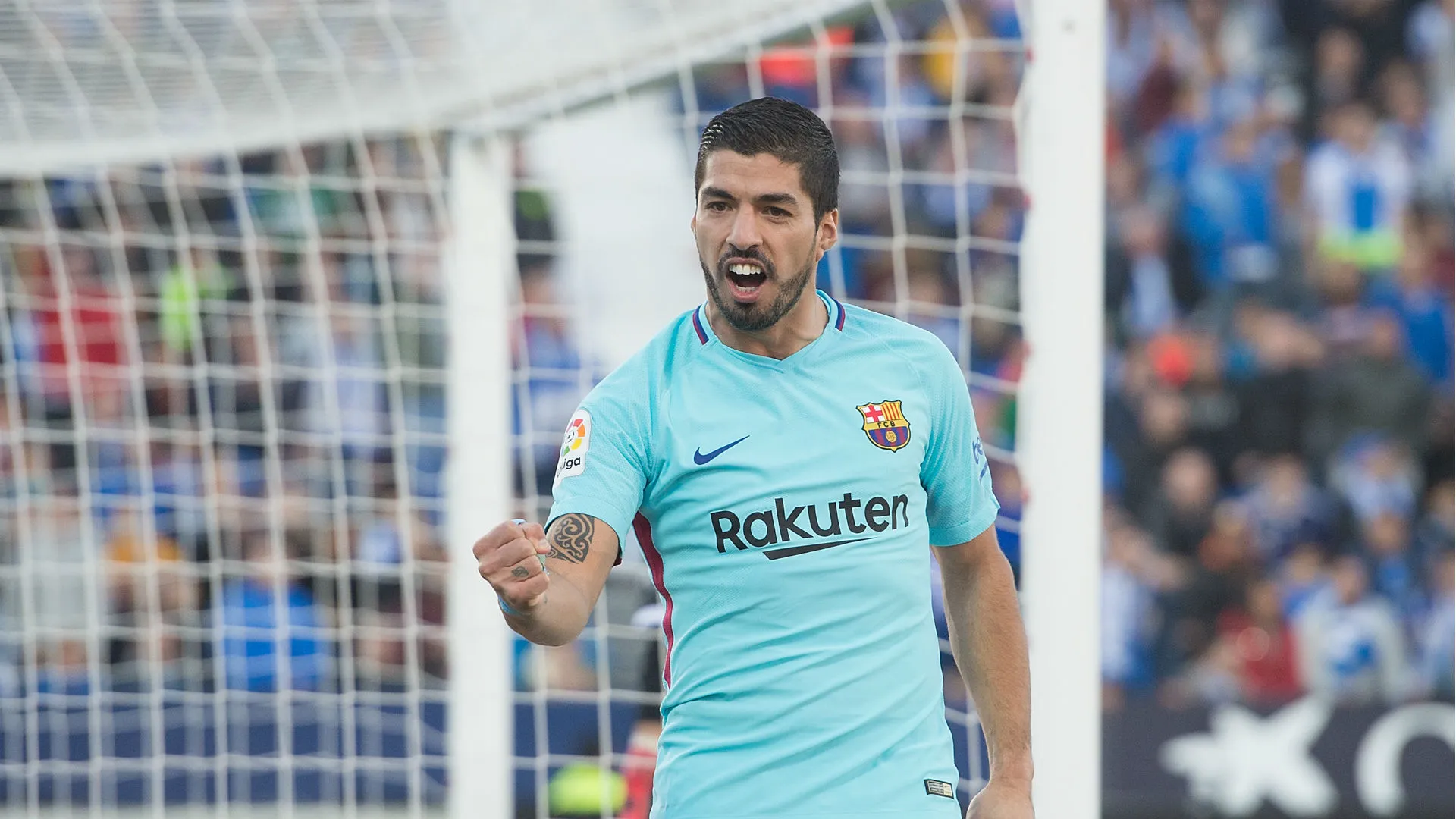 suarez-cropped_1hctlgz8s5c421uwiuz8hkp02y.jpg
