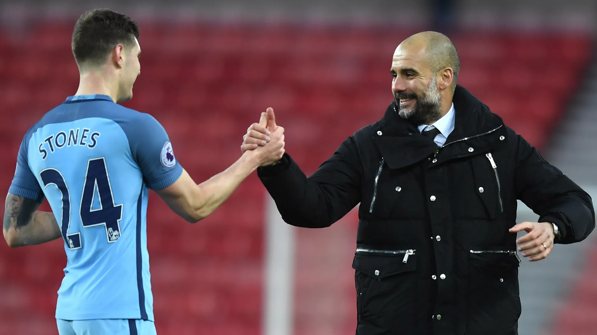 john-stones-and-pep-guardiola-cropped_18fe6sgg4gr4a1d2zfayxvre36.jpg