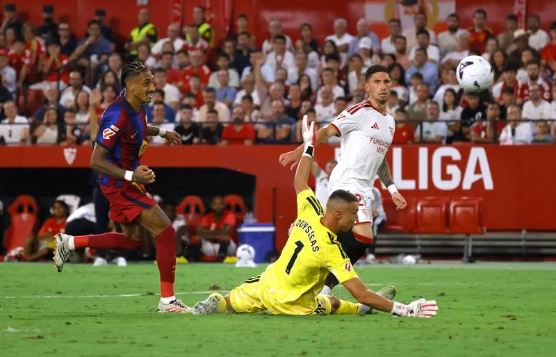 SOCCER-SPAIN-SEV-BAR:Soccer-Raphinha hat-trick maintains Barcelona’s perfect LaLiga start