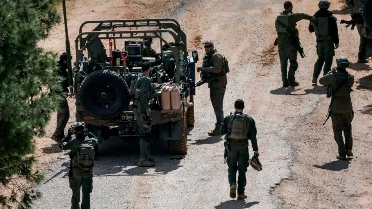 Israeli soldiers gather on the Israeli side of the border with Lebanon, amid escalation between Hezbollah and Israel, and amid the US-Israeli conflict with Iran, in northern Israel, March 16, 2026 [Shir Torem/Reuters]
