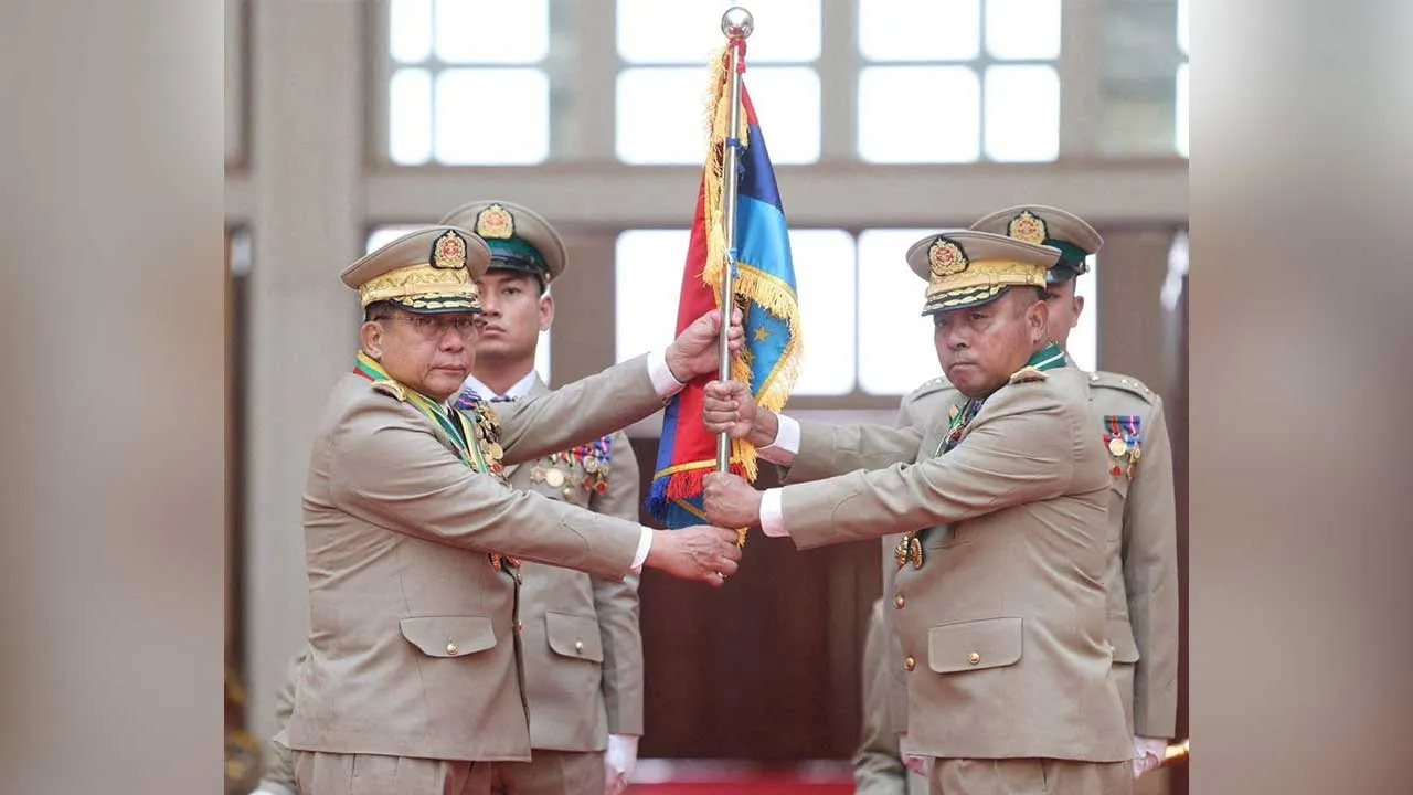 FILE PHOTO: Myanmar junta chief Senior General Min Aung Hlaing hands over a flag to newly appointed Commander-in-Chief General Ye Win Oo during a ceremony in Naypyitaw, Myanmar, March 30, 2026. Myanmar Military True News Information Team/Handout via REUTERS ATTENTION EDITORS - THIS IMAGE HAS BEEN SUPPLIED BY A THIRD PARTY./File Photo