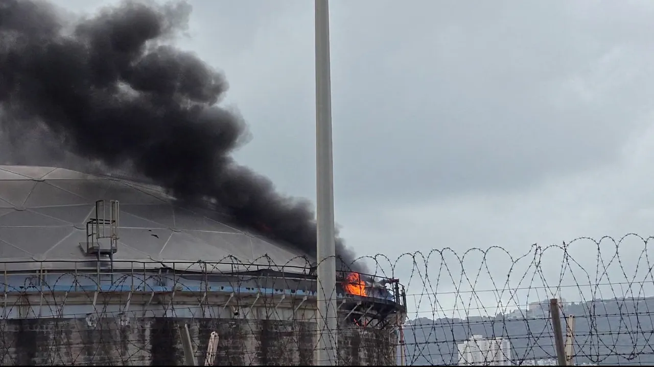 A blaze after Israel's Fire and Rescue Service said that an industrial building and a fuel tanker at Israel's Oil Refineries were hit by debris from an intercepted Iranian missile, amid the U.S.-Israel conflict with Iran, in Haifa, Israel March 30, 2026, in this screengrab obtained from a video. VIDEO OBTAINED BY REUTERS/Handout via REUTERS THIS IMAGE HAS BEEN SUPPLIED BY A THIRD PARTY. VERIFICATION: - Reuters confirmed the location by the road markings, layout and cylinders which matched satellite imagery.