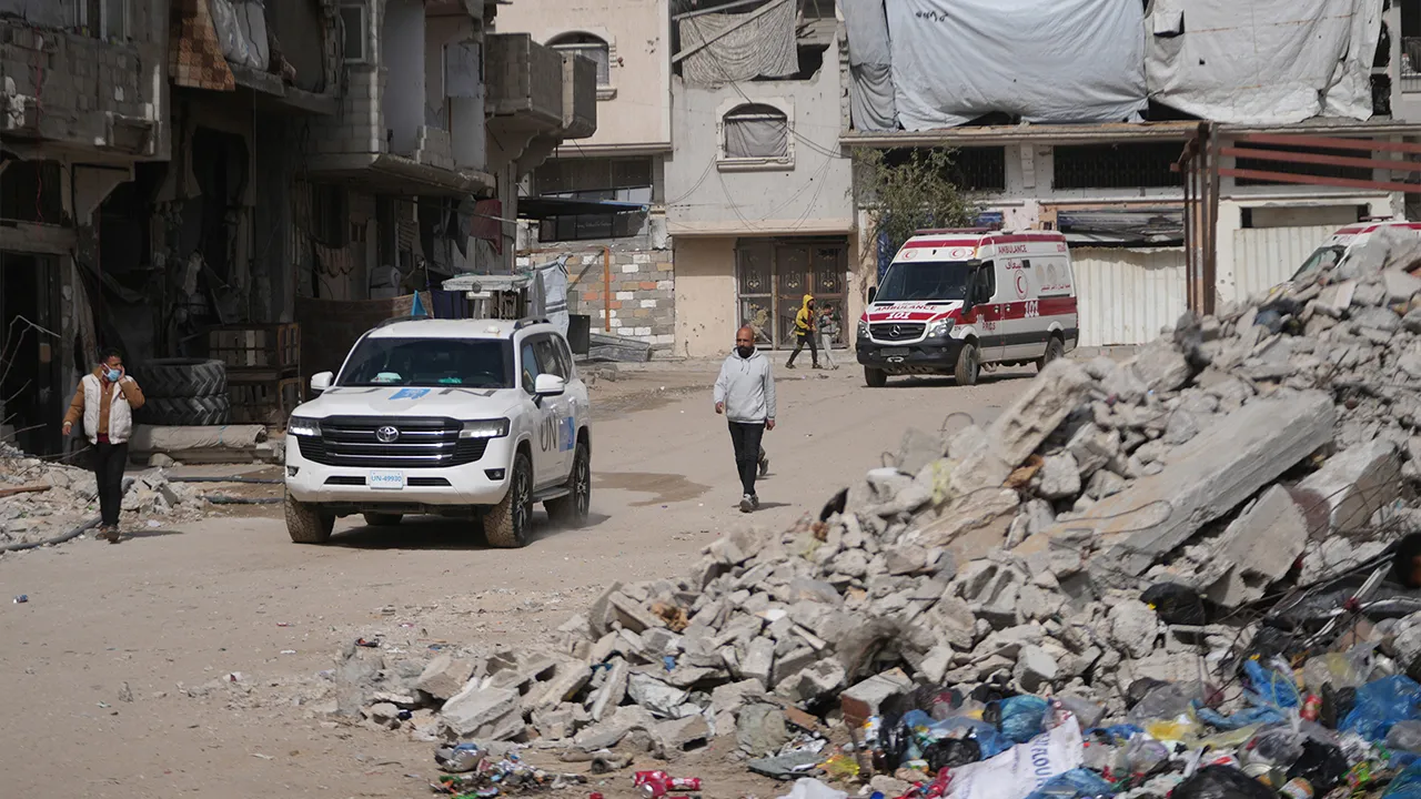 U.N. vehicles escort ambulances and a bus carrying Palestinian patients in Khan Younis as they travel to the Rafah crossing to leave the Gaza Strip for medical treatment abroad, Thursday, Mar, 19, 2026. (AP Photo/Abdel Kareem Hana)