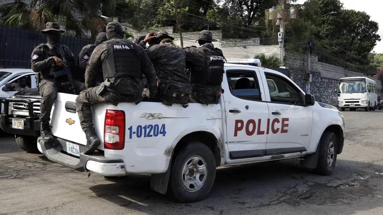 FILE PHOTO: Haitian security forces partrol the Prime Minister's office and the headquarters of the Transitional Presidential Council (CPT), as the mandate of the transitional governing council, formed to curb gang violence and pave the way for long-delayed election, is set to end on February 7 with no succession plan in place, in Port-au-Prince, Haiti, February 6, 2026. REUTERS/Egeder Pq Fildor/File Photo