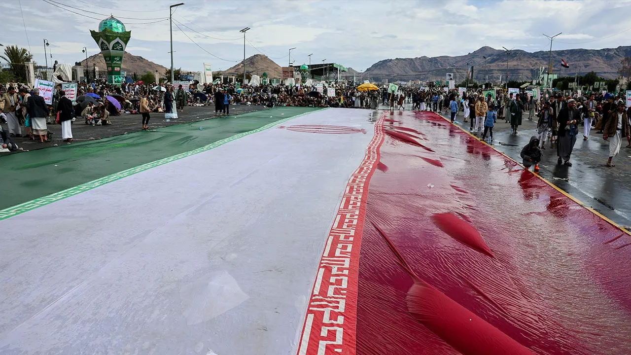 A giant Iranian flag lies on the ground at the site of a rally of Houthi supporters in solidarity with Iran, as the U.S.-Israeli conflict with Iran continues, in Sanaa, Yemen, March 27, 2026. REUTERS/Khaled Abdullah