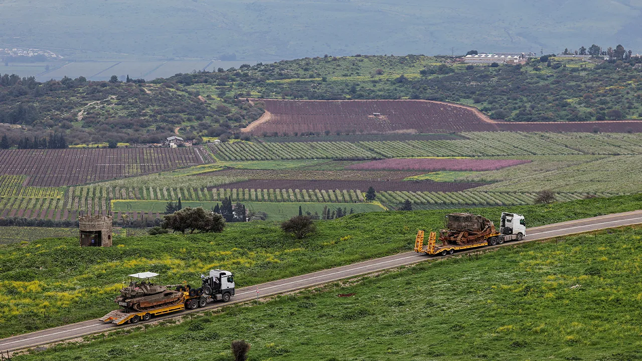 Israeli tank and bulldozer are transported near the Israeli side of the border with Lebanon, amid escalating hostilities between Israel and Hezbollah, as the U.S.-Israeli conflict with Iran continues, in northern Israel, March 26, 2026. REUTERS/Tyrone Siu TPX IMAGES OF THE DAY