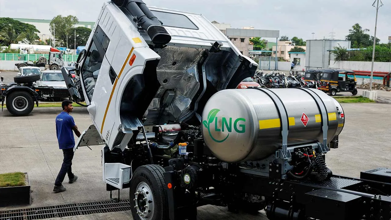 FILE PHOTO: A man opens the hood of a Blue Energy 5528 liquefied natural gas (LNG) truck to check the engine at the manufacturing facility in Pune, India, October 11, 2024. REUTERS/Francis Mascarenhas/File Photo