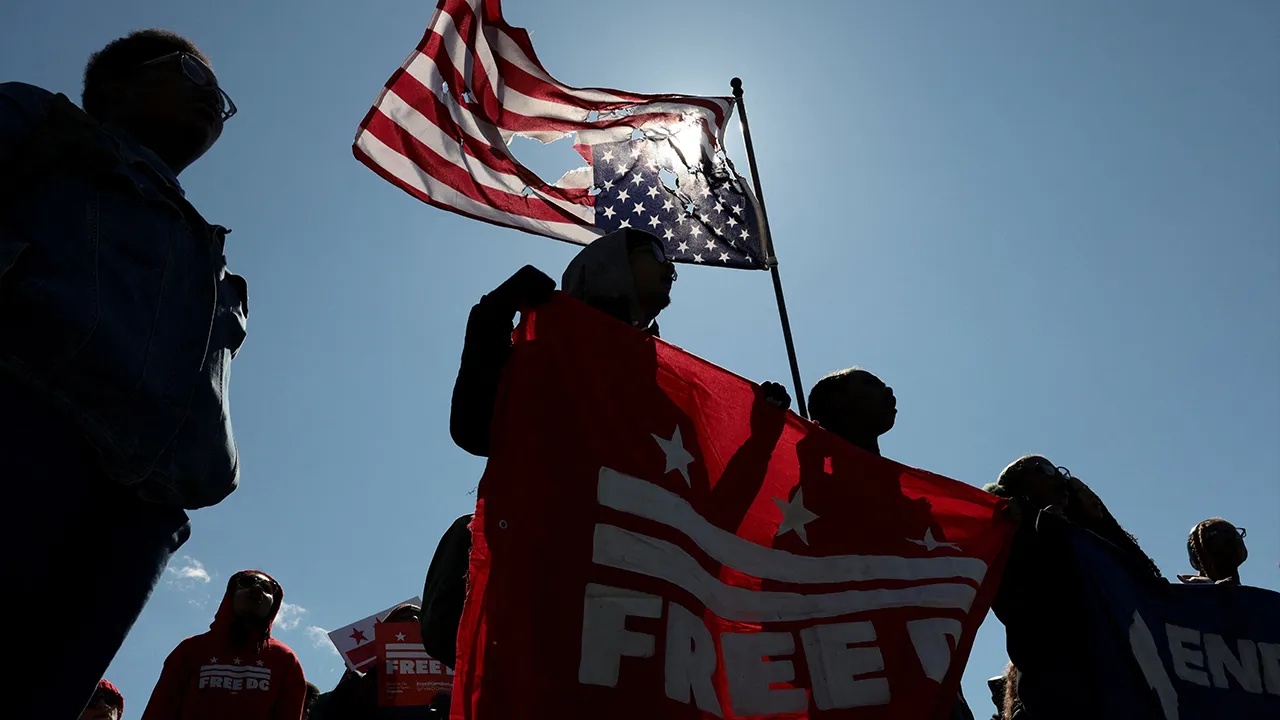 Demonstrators march during a protest amid nationwide demonstrations against U.S. President Donald Trump's administration policies, in Washington, D.C., U.S., March 28, 2026. REUTERS/Evelyn Hockstein