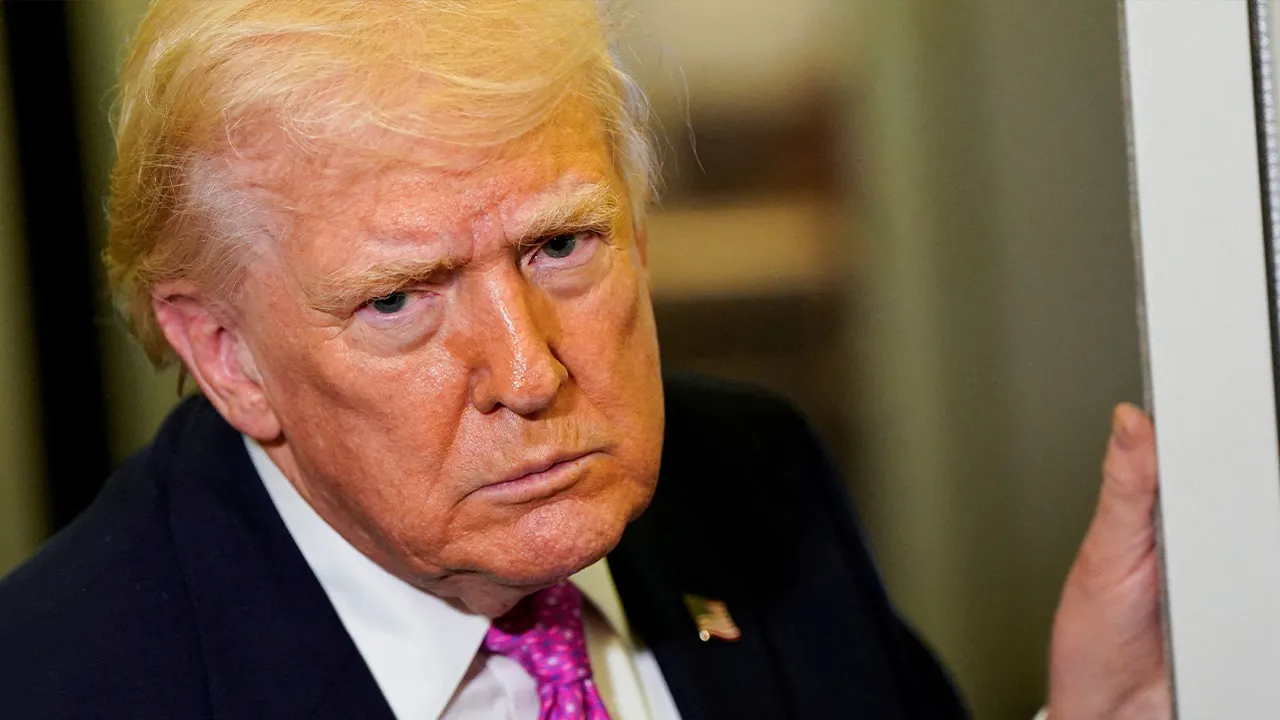 U.S. President Donald Trump looks on as he speaks to members of the media aboard Air Force One en route to Joint Base Andrews, Maryland, U.S., March 29, 2026. REUTERS/Elizabeth Frantz