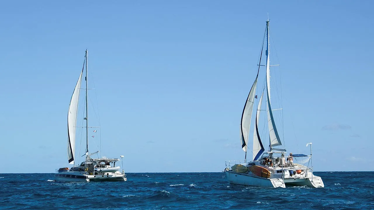 FILE PHOTO: The sailboats Friendship and Tigger Moth, carrying humanitarian aid for Cuba and crewed by activists taking part in the Nuestra America Convoy flotilla, depart Isla Mujeres, in Isla Mujeres, Quintana Roo state, Mexico, March 21, 2026. Mexico’s navy activated a search‑and‑rescue operation on March 26, in the Caribbean to locate the vessels after they failed to arrive in Havana as scheduled. REUTERS/Paola Chiomante/File Photo