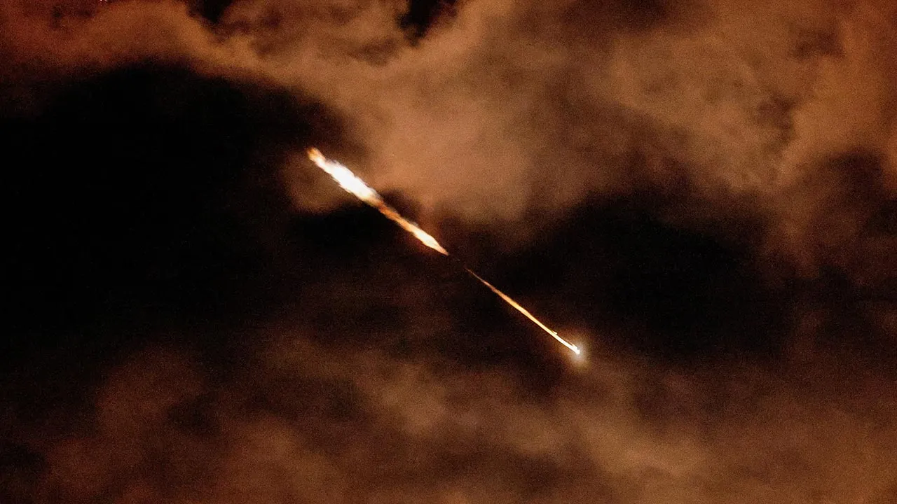 Streaks of light illuminate the sky during an interception attempt, amid the U.S.-Israeli conflict with Iran, as seen from Ashkelon, Israel, March 28, 2026. REUTERS/Amir Cohen