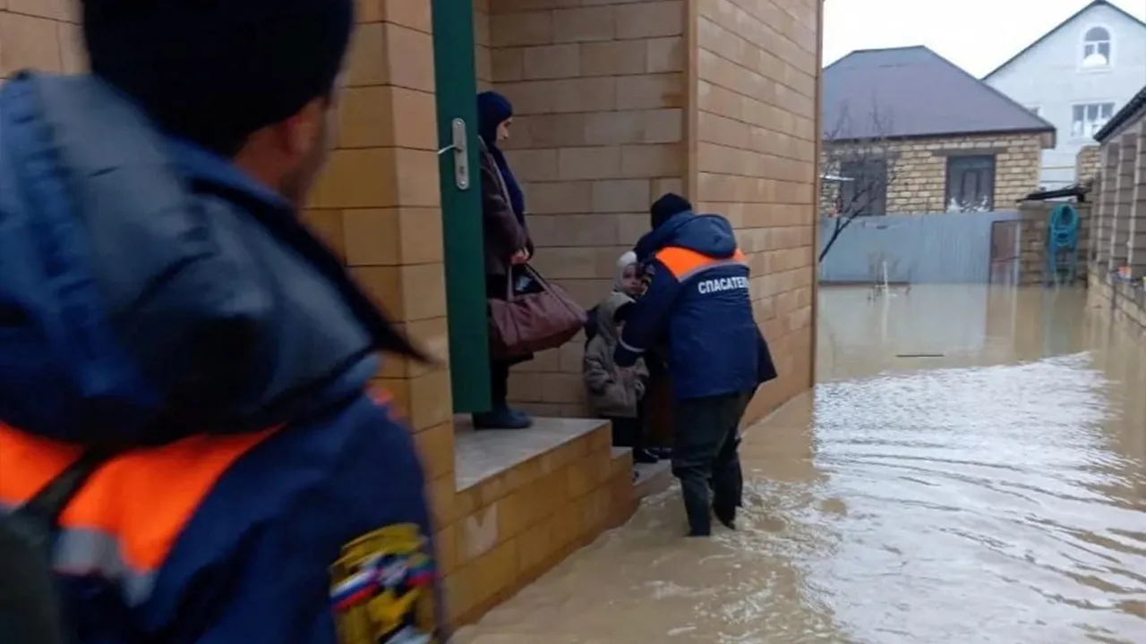 Emergency specialists evacuate residents from a flooded district in the city of Derbent in the Caucasus region of Dagestan, Russia, in this picture released March 28, 2026. Emergency Ministry of Dagestan/Handout via REUTERS ATTENTION EDITORS - THIS IMAGE WAS PROVIDED BY A THIRD PARTY. NO RESALES. NO ARCHIVES. MANDATORY CREDIT