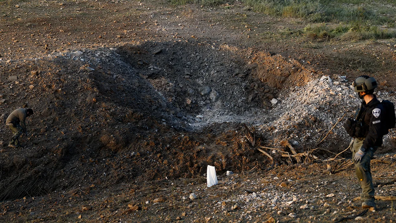 Emergency personnel work at an impact site following an Iranian missile strike, as the U.S.-Israeli conflict with Iran continues, in southern Israel, March 29, 2026. REUTERS/Amir Cohen