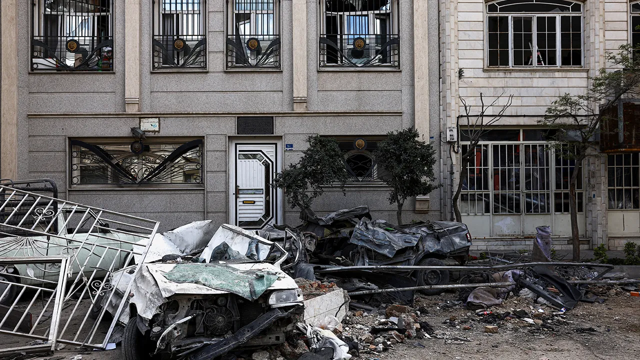 Car wrecks and a residential building damaged by a strike amid the U.S.-Israeli conflict with Iran, in Tehran, Iran, March 30, 2026. Majid Asgaripour/WANA (West Asia News Agency) via REUTERS ATTENTION EDITORS - THIS PICTURE WAS PROVIDED BY A THIRD PARTY