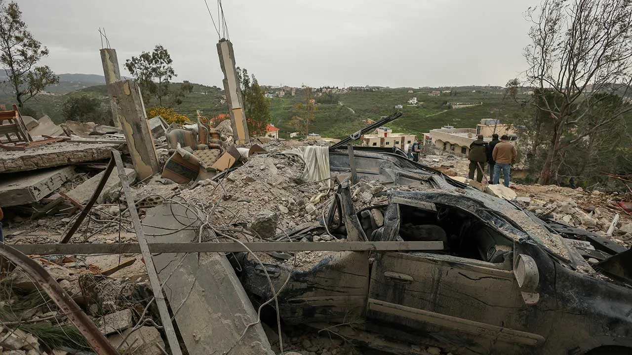 A destroyed car among the rubble of a house hit by an Israeli strike, amid escalating hostilities between Israel and Hezbollah, as the U.S.-Israel conflict with Iran continues, in Houmine El Tahta, Lebanon, April 1, 2026. REUTERS/Yara Nardi TPX IMAGES OF THE DAY