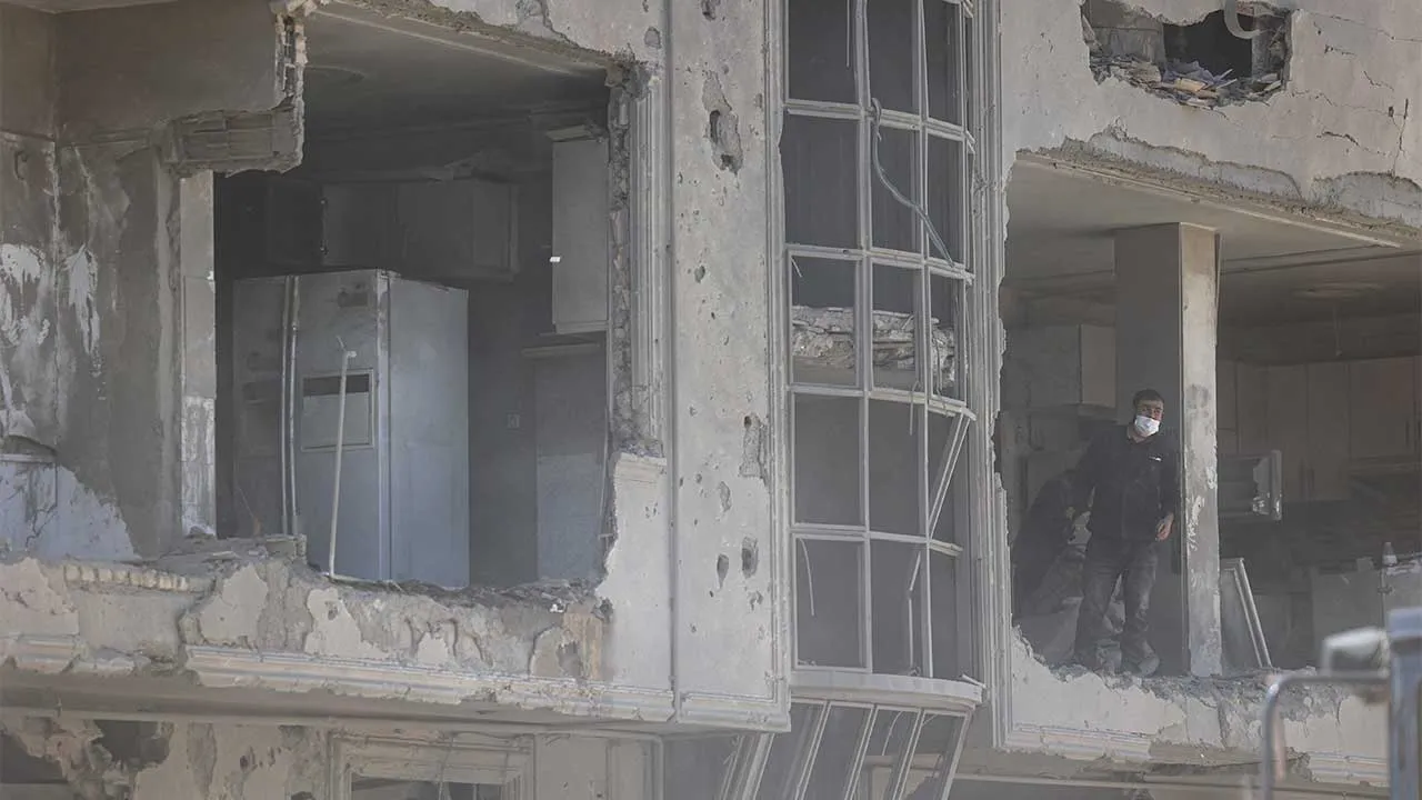 A man stands at his home damaged by a strike amid the U.S.-Israeli conflict with Iran, in Tehran, Iran, March 30, 2026. Majid Asgaripour/WANA (West Asia News Agency) via REUTERS ATTENTION EDITORS - THIS PICTURE WAS PROVIDED BY A THIRD PARTY