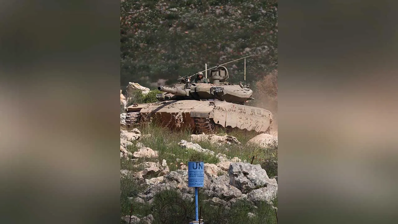 An Israeli tank manoeuvres in Lebanon, near the "Blue Line", a U.N.-mapped line separating Lebanon from Israel and the Israeli-occupied Golan Heights, as seen from the Israeli side of the Lebanon-Israel border in northern Israel, April 13, 2026. REUTERS/Florion Goga