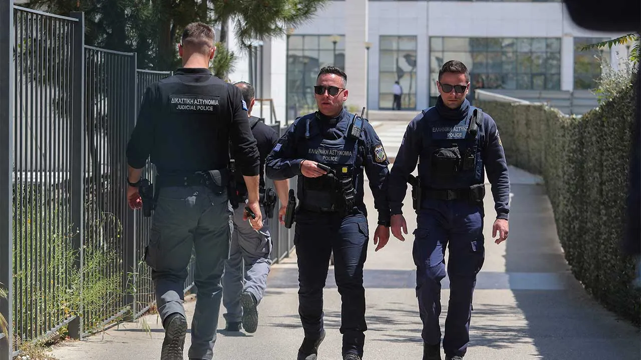 Police officers walk outside the Athens’ Court of Appeal following a shooting incident that left several wounded, in Athens, Greece, April 28, 2026. Sotiris Dimitropoulos/Eurokinissi via REUTERS THIS IMAGE HAS BEEN PROVIDED BY A THIRD PARTY. NO RESALES. NO ARCHIVES. MANDATORY CREDIT. GREECE OUT. NO COMMERCIAL OR EDITORIAL SALES IN GREECE.