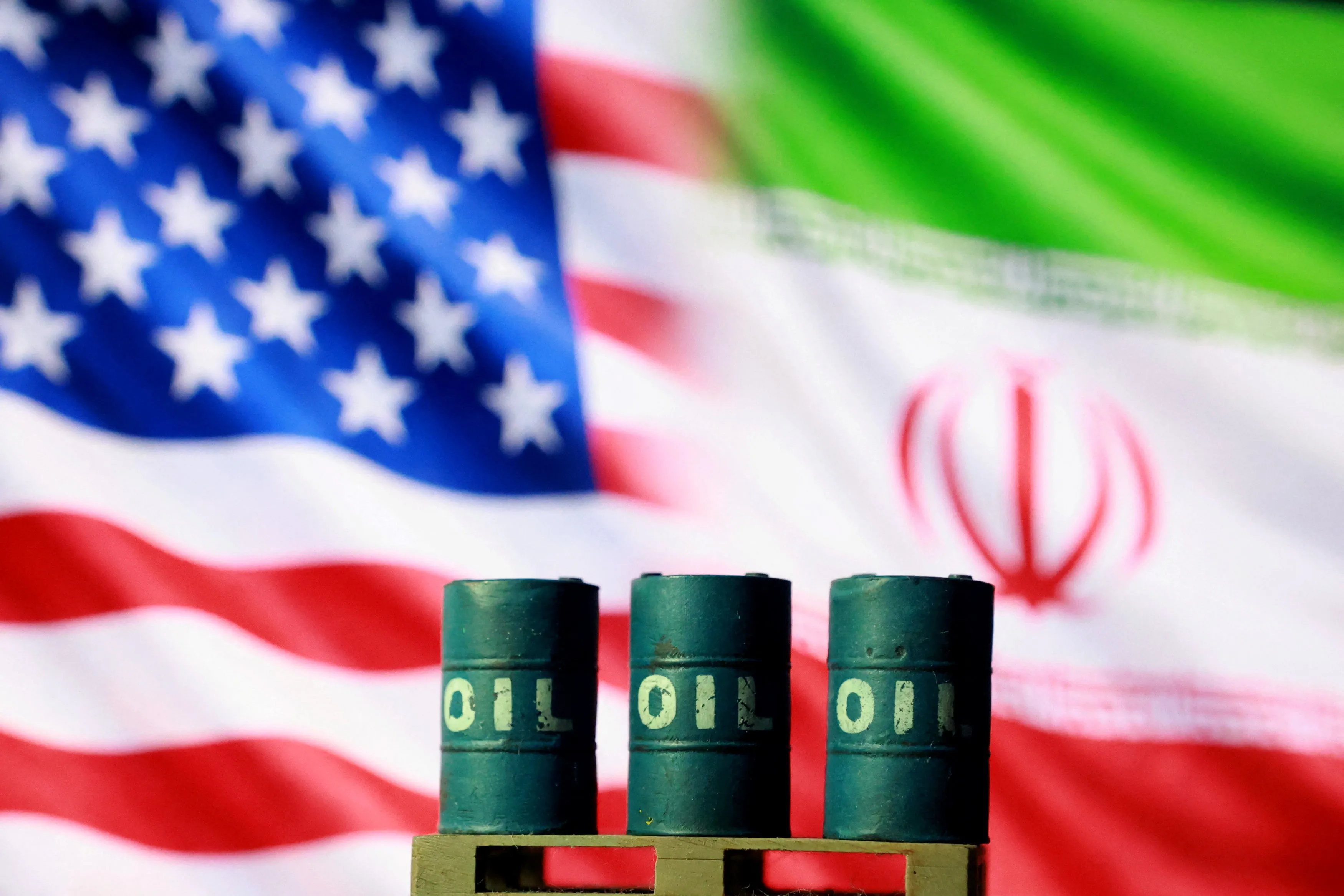 U.S. and Iranian flags and 3D printed oil barrels