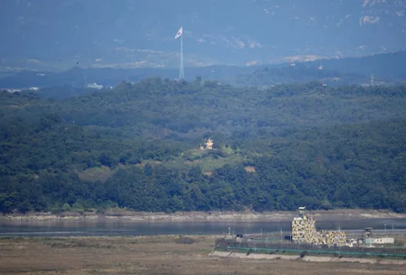 South and North Korean guard posts face each other as a South Korean national flag flutters in this picture taken from the Unification Observation Platform, near the demilitarized zone which separates the two Koreas in Paju, South Korea, October 6, 2022. REUTERS/Kim Hong-Ji 