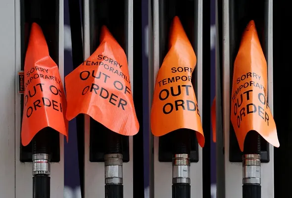 "Out of order" signs cover fuel pumps at a petrol station in Sydney, Australia