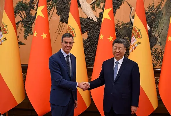 Chinese President Xi Jinping and Spain's Prime Minister Pedro Sanchez shake hands at the Great Hall of the People