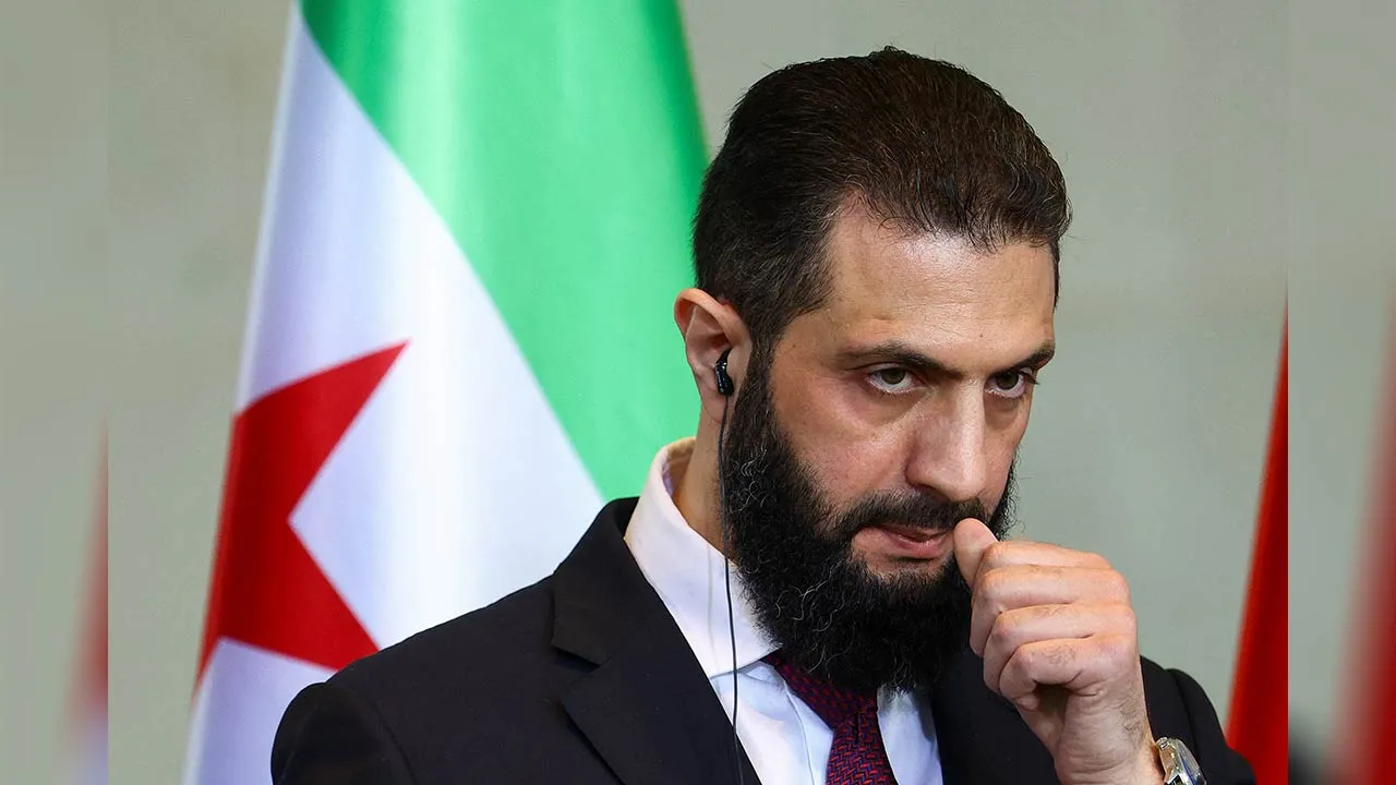 Syrian President Ahmed al-Sharaa attends a press conference with German Chancellor Friedrich Merz (not pictured), at the Chancellery, in Berlin, Germany March 30, 2026. REUTERS/Lisi Niesner