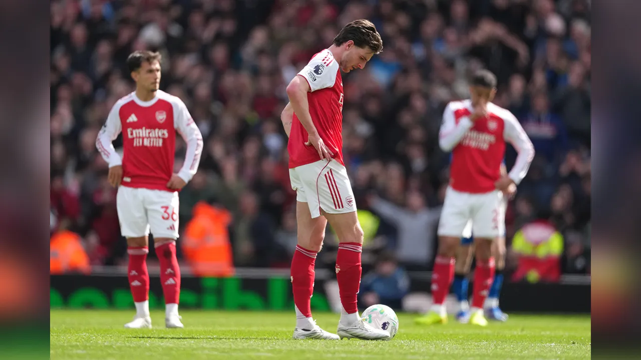 Arsenal's Declan Rice stands dejeted after conceding a goal during the Premier League soccer match between Arsenal and Bournemouth in London, England Saturday, April 11, 2026. (AP Photo/Dave Shopland)