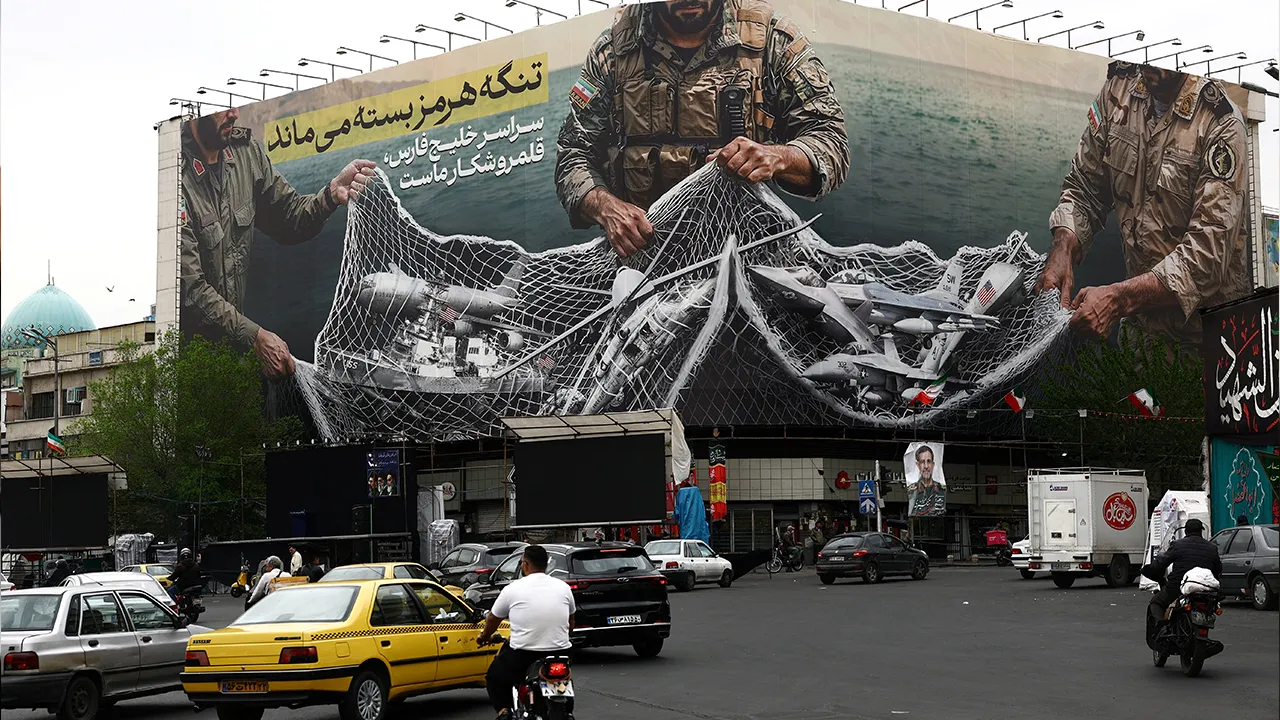 Cars drive near an anti-U.S. billboard on a building in Tehran, Iran, April 12, 2026. Majid Asgaripour/WANA (West Asia News Agency) via REUTERS ATTENTION EDITORS - THIS PICTURE WAS PROVIDED BY A THIRD PARTY