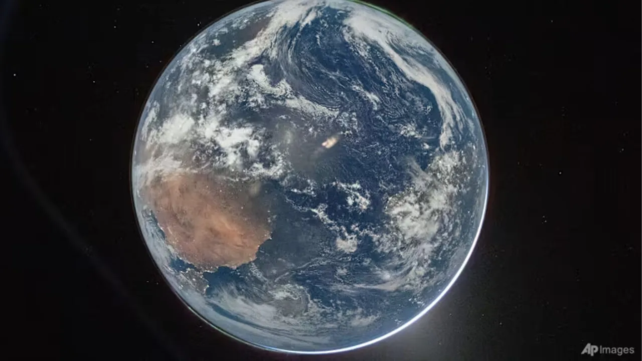 This image provided by NASA shows a view of Earth taken by NASA astronaut and Artemis II Commander Reid Wiseman from of the Orion spacecraft's window after completing the translunar injection burn on Apr 2, 2026. (Photo: AP/NASA)