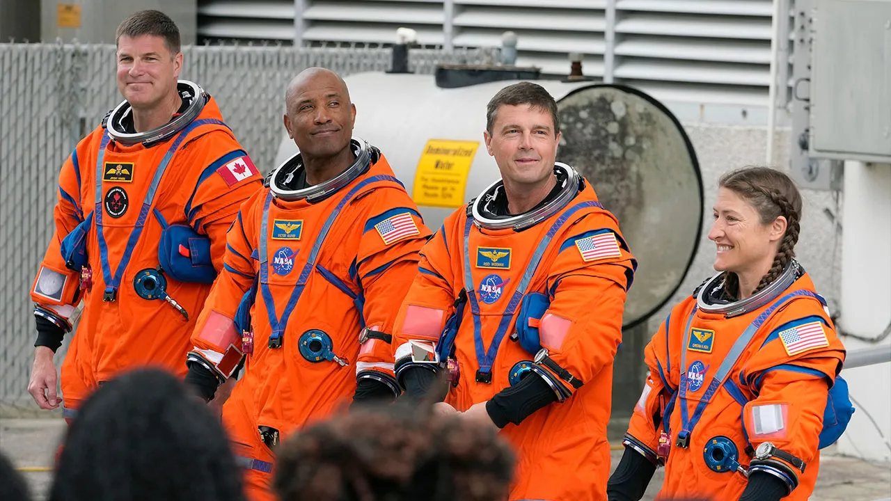 Astronauts, from left, Mission Specialist Jeremy Hansen, of Canada,, Pilot Victor Glover, Commander Reid Wiseman, and Mission Specialist Christina Koch pose for a photo after leaving the Operations and Checkout Building for a trip to Launch Pad 39-B and a planned liftoff on NASA's Artemis II moon rocket at the Kennedy Space Center Wednesday, April 1, 2026, in Cape Canaveral, Fla. (AP Photo/Chris O'Meara)