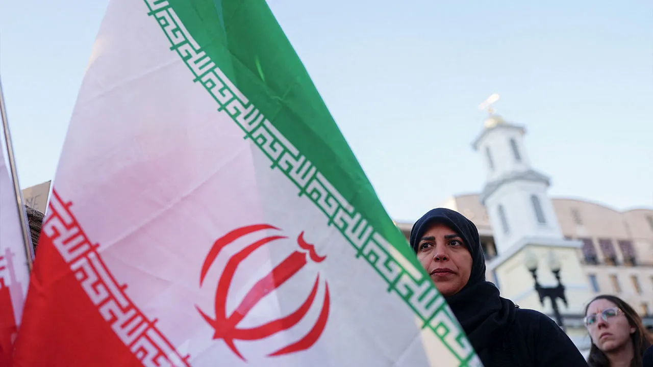 Demonstrators protest against military action in Iran after U.S. President Donald Trump said that he had agreed to a two-week ceasefire with Iran, less than two hours before his deadline for Tehran to reopen the Strait of Hormuz or face widespread attacks on its civilian infrastructure, outside the White House in Washington, D.C., U.S., April 7, 2026. REUTERS/Nathan Howard