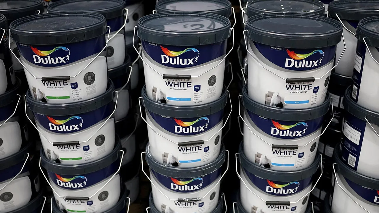 FILE PHOTO: Cans of Dulux paint, an AkzoNobel brand, are seen on the shelf of a DIY retail store in Manchester, Britain, June 14, 2024. REUTERS/Phil Noble/File Photo
