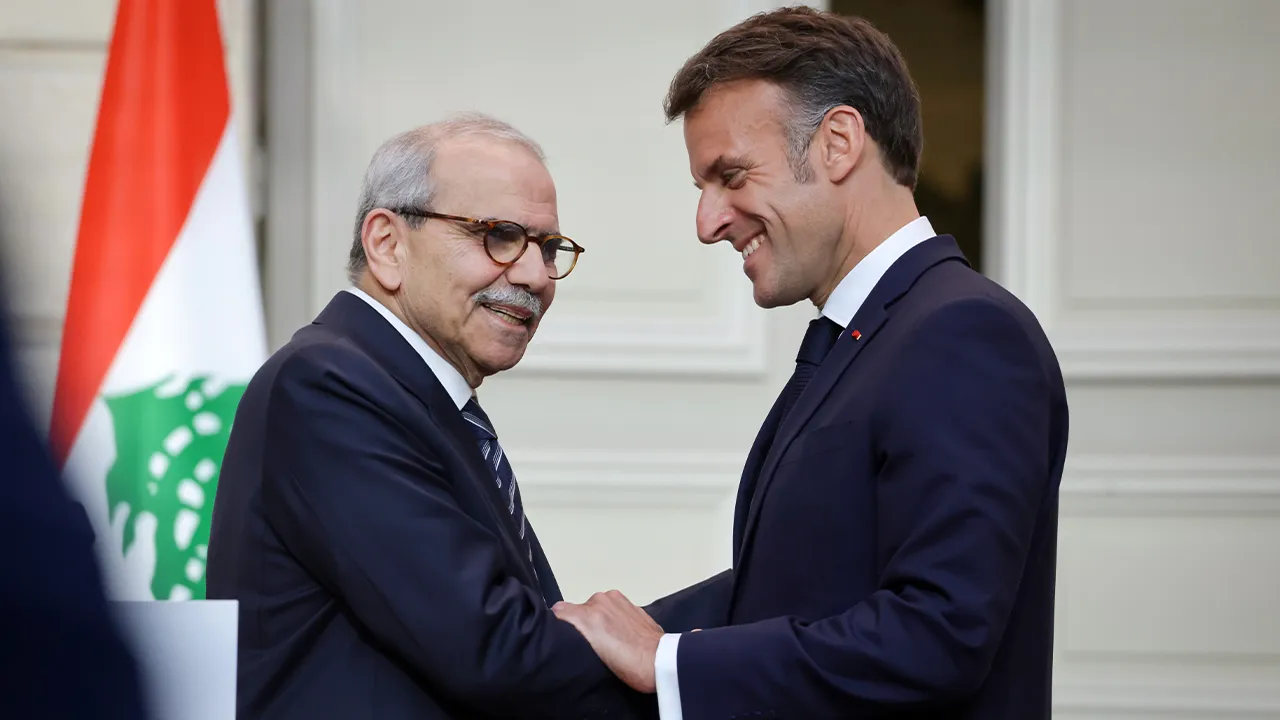 France's President Emmanuel Macron, right, and Lebanon's Prime Minister Nawaf Salam shake hands after a joint declaration press event following their meeting at the Elysee Presidential Palace in Paris, Tuesday, April 21, 2026. (Ludovic Marin/Pool Photo via AP)