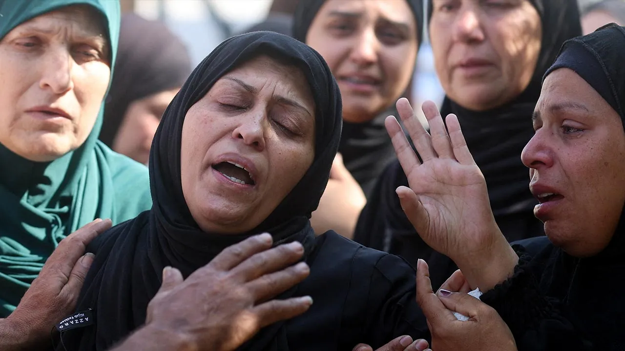 Mourners react during the funeral of Palestinians, including police officers, who were killed in an Israeli strike on Friday, according to medics, at Nasser Hospital in Khan Younis, in the southern Gaza Strip, April 25, 2026. REUTERS/Ramadan Abed