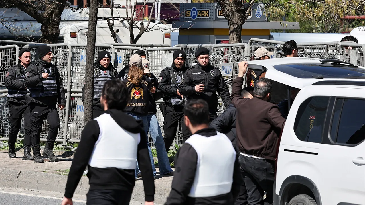 Police officers walk near the scene, after a gunfire was heard near the building housing the Israeli consulate, according to a witness, in Istanbul, Turkey, April 7, 2026. REUTERS/Umit Bektas