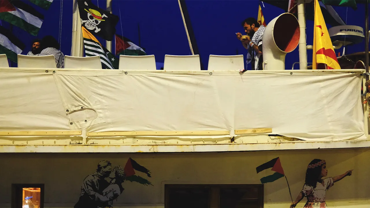Brazilian Thiago Avila, GSF Steering Committee Member, eats inside a boat of a humanitarian flotilla preparing to depart for Gaza, in Barcelona, Spain, April 11, 2026. REUTERS/Nacho Doce