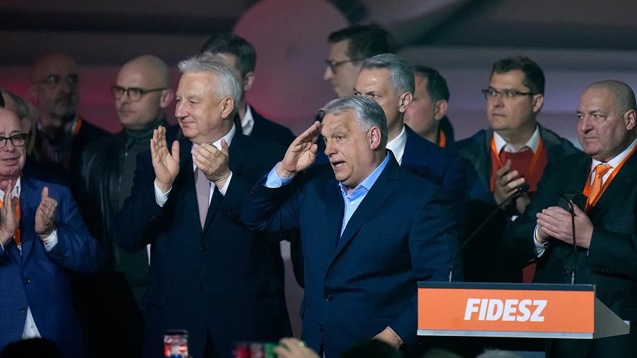 Hungary's Prime Minister Viktor Orban, center, flanked by his team reacts after a parliamentary election in Budapest, Hungary, Sunday, April 12, 2026. (AP Photo/Petr David Josek)