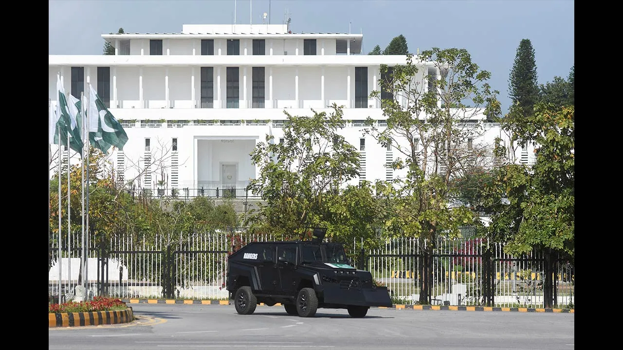 A security vehicle moves past the President house as Pakistan gears up to host the U.S. and Iran for peace talks, in Islamabad, Pakistan, April 9, 2026. REUTERS/Waseem Khan