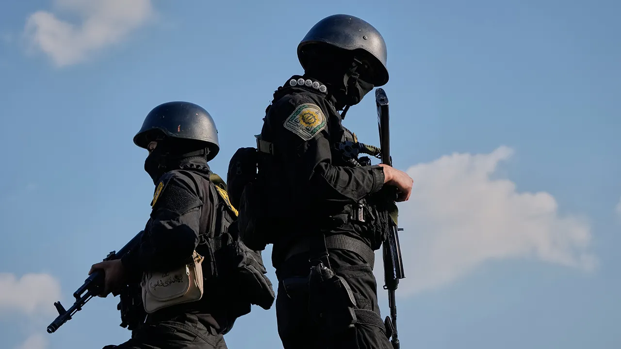 Iranian police special forces stand guard during a funeral procession for Alireza Tangsiri, head of Iran's Islamic Revolutionary Guard Corps Navy, and others killed in Israeli strikes in late March, in Tehran, Iran, Wednesday, April 1, 2026. (AP Photo/Vahid Salemi)