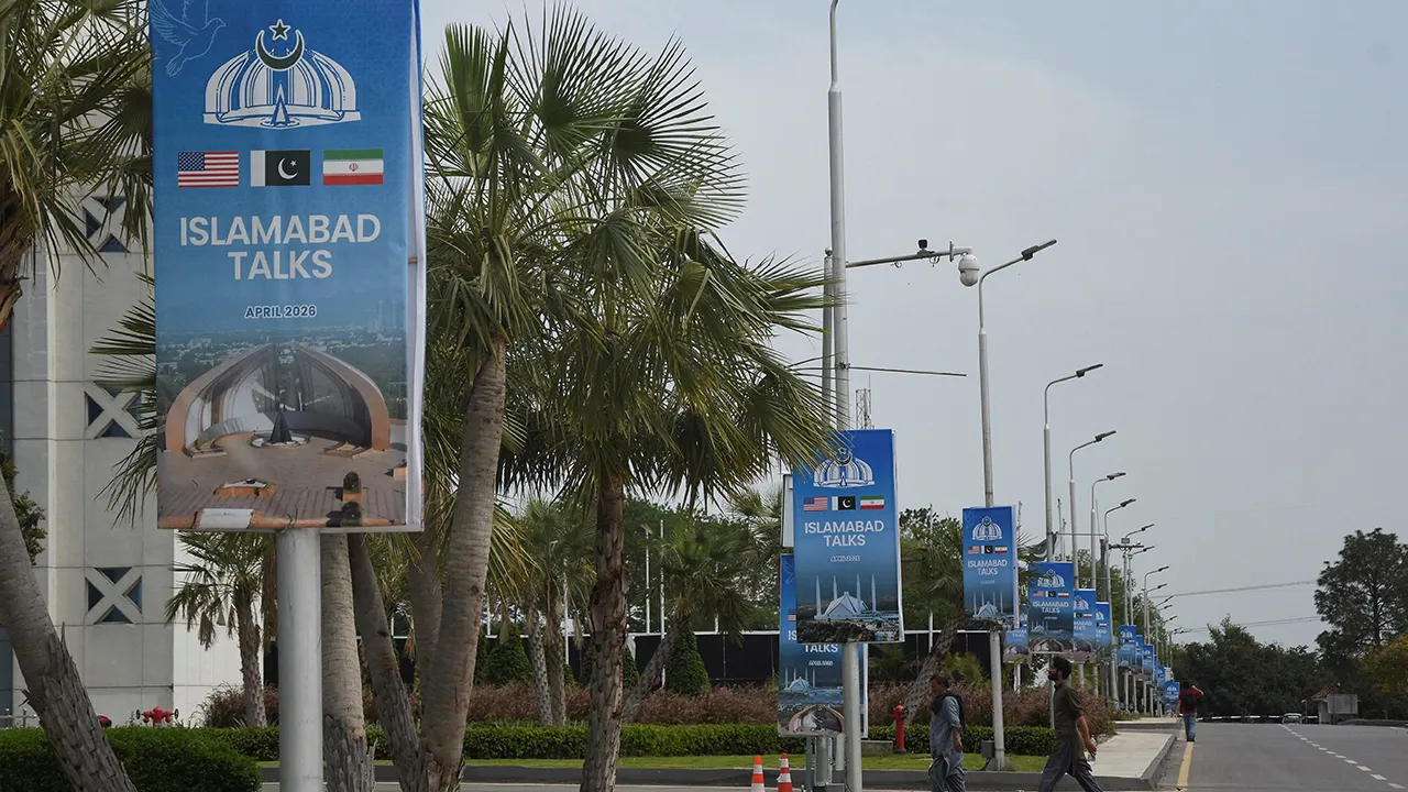Hoardings displaying flags of the U.S, Pakistan and Iran, as Pakistan prepares to host the U.S. and Iran for the second phase of peace talks in Islamabad, Pakistan, April 18, 2026. REUTERS/Waseem Khan