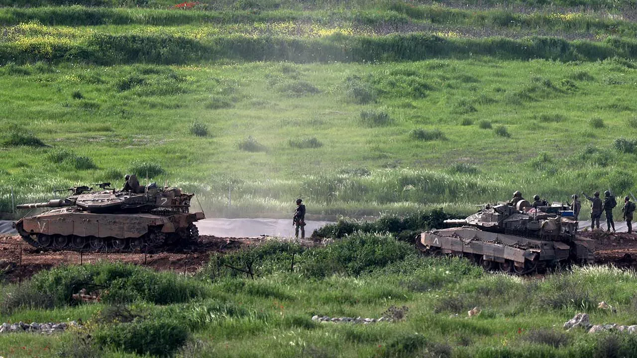 Israeli tanks operate in Lebanon, near the Israel-Lebanon border, as seen from the Israeli side of the border in northern Israel, April 14, 2026. REUTERS/Florion Goga TPX IMAGES OF THE DAY
