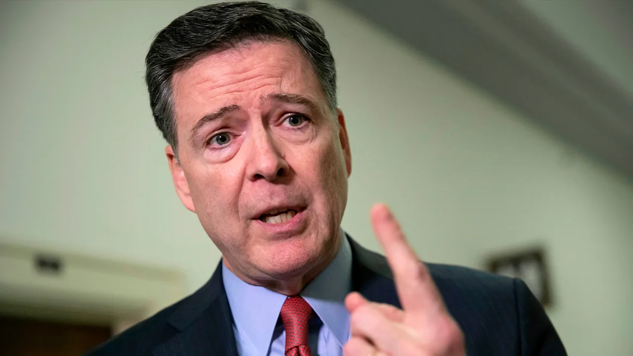 FILE - Former FBI Director James Comey speaks to reporters on Capitol Hill in Washington, Dec. 17, 2018. (AP Photo/J. Scott Applewhite, File)