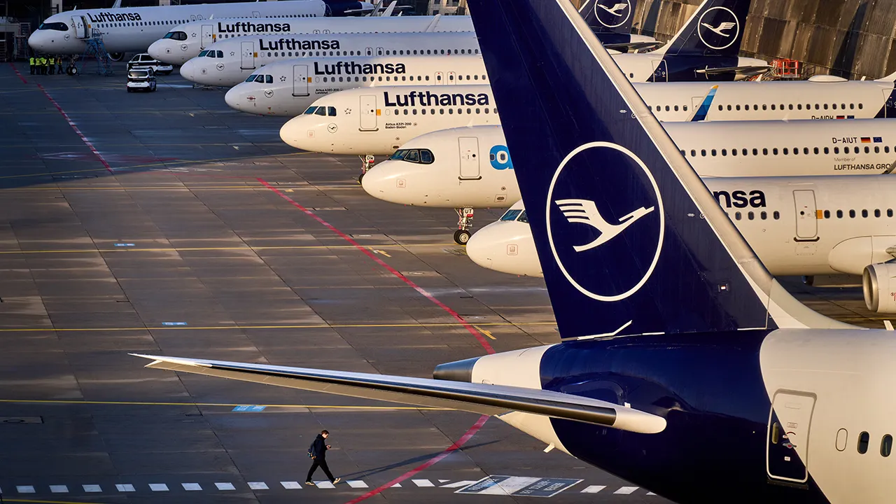 A man walks past parked Lufthansa aircraft at the airport as Lufthansa pilots are on a two-day strike, in Frankfurt, Germany, Thursday, March 12, 2026. (AP Photo/Michael Probst, File)