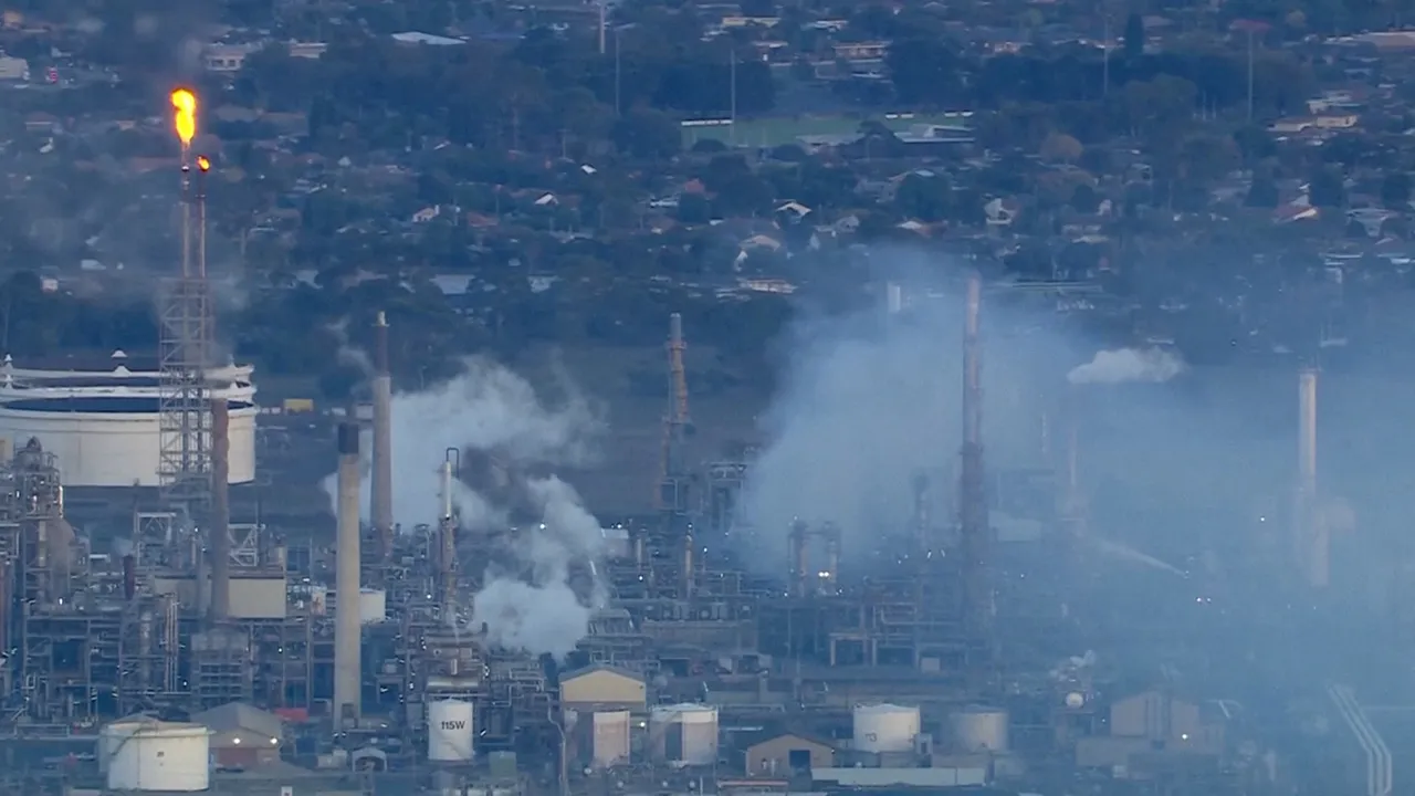 An aerial view shows smoke rising following a fire at Viva Energy Group's refinery in Geelong, Australia, April 16, 2026, in this screengrab from a video. Seven Network/Nine Network/Handout via REUTERS 