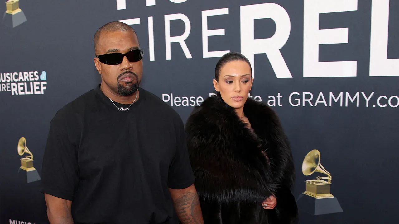 Kanye West and Bianca Censori pose at the red carpet during the 67th Annual Grammy Awards in Los Angeles, California, U.S., February 2, 2025. REUTERS/Daniel Cole