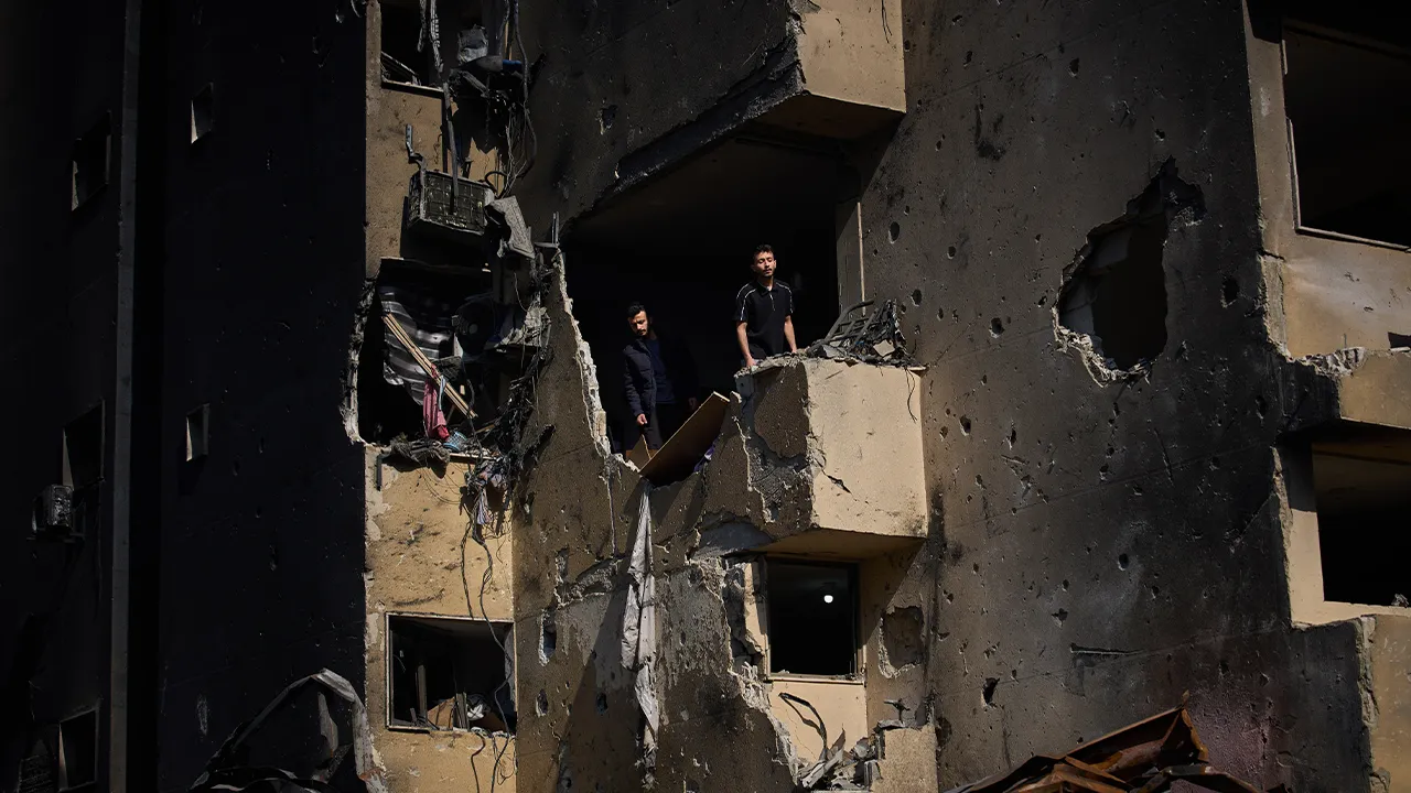 Men inspect the damage to their home destroyed in an Israeli airstrike a day earlier in Beirut, Lebanon, Thursday, April 9, 2026. (AP Photo/Emilio Morenatti)