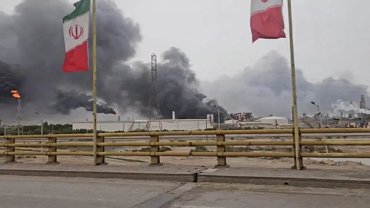 Smoke rises after strikes on the Mahshahr Petrochemical Zone in Bandar Mahshahr County, Khuzestan Province, Iran, in this handout picture released April 4, 2026, and obtained from a social media video. SOCIAL MEDIA/via REUTERS THIS IMAGE HAS BEEN SUPPLIED BY A THIRD PARTY. MANDATORY CREDIT. NO RESALES. NO ARCHIVES. VERIFICATION LINE: Reuters confirmed the location from the flare and smoke stacks, towers, plant buildings, road layout and trees, which matched satellite imagery of the Mahshahr Petrochemical Zo