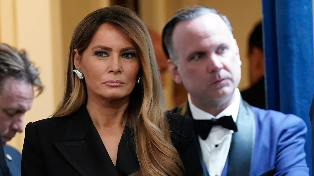 First lady Melania Trump and White House deputy chief of staff Dan Scavino listen as President Donald Trump speaks in the James Brady Press Briefing Room at the White House after a shooting incident outside the ballroom at the annual White House Correspondents' Association Dinner in Washington, Saturday, April 25, 2026. (AP Photo/Jose Luis Magana)