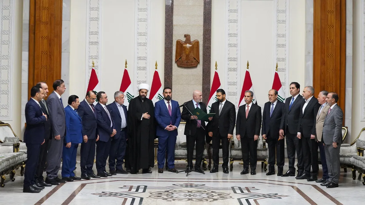 Iraqi President Nizar Amedi and Ali al-Zaidi, the nominee of Iraq's Shiite Coordination Framework for prime minister, stand with political figures during a ceremony where Zaidi was tasked with forming a new government, in Baghdad, Iraq, April 27, 2026. Iraqi President Media Office/Handout via REUTERS ATTENTION EDITORS – THIS IMAGE HAS BEEN SUPPLIED BY A THIRD PARTY